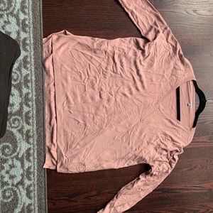 Two sweaters. Blush pink and rusty orange.